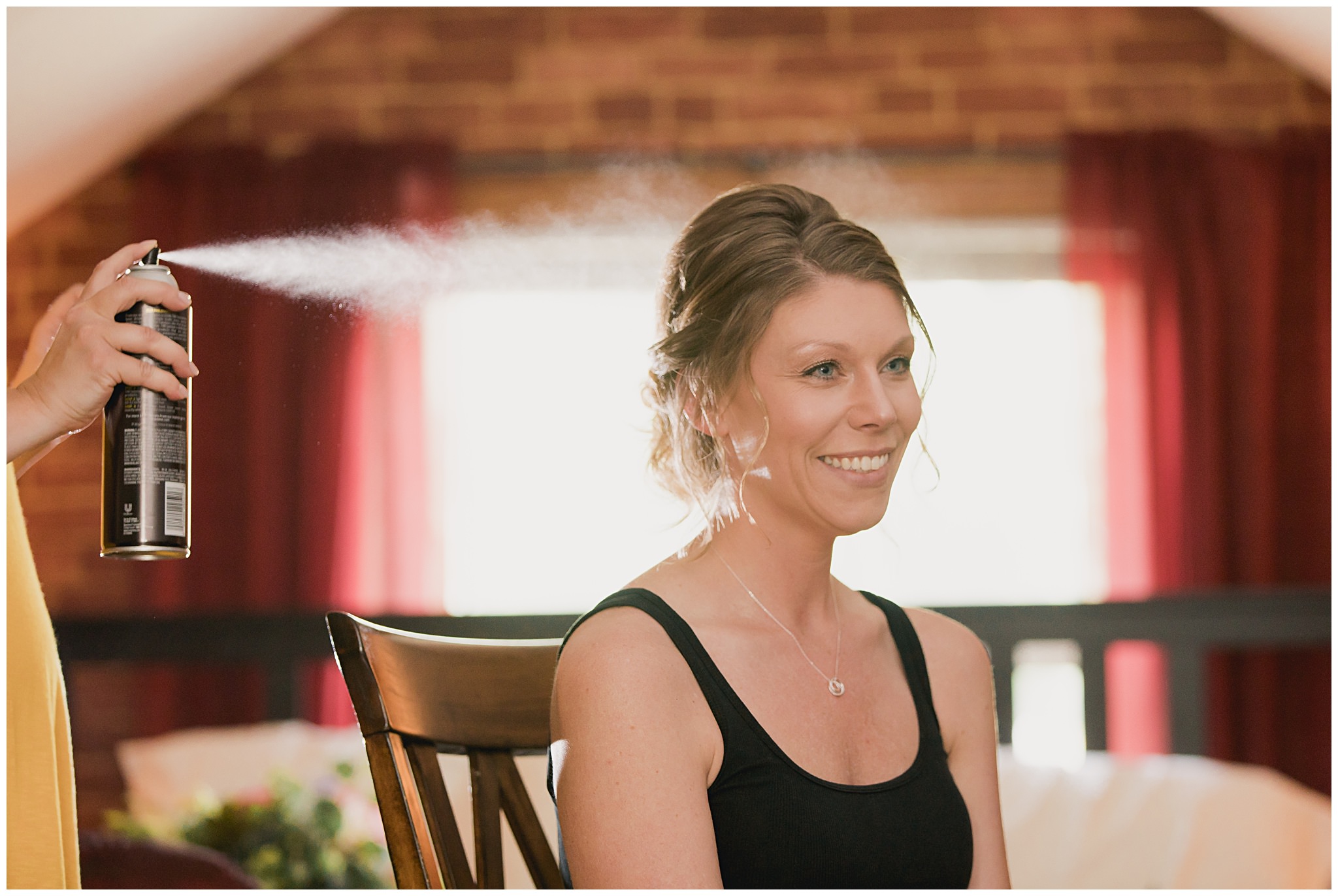 bride getting hairspray